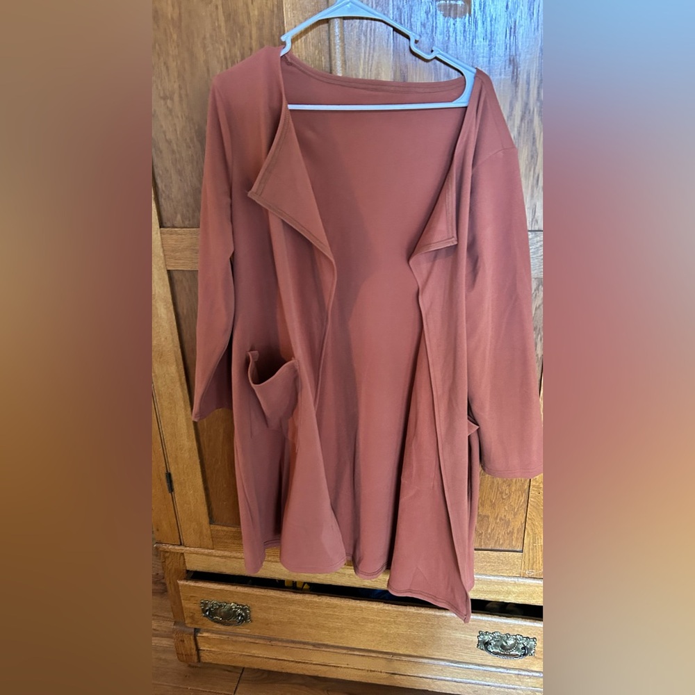Manufacturer unknown. Ordered on Amazon, soft material, flowy cover up grey L